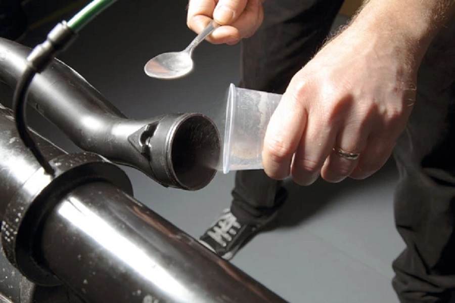 Debris being funneled into the filter setup.