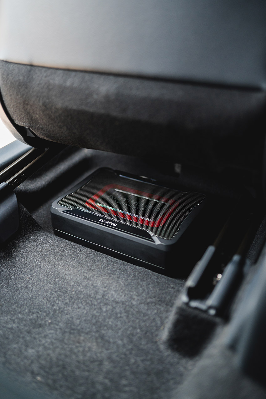Kenwood underseat subwoofer in position under seat