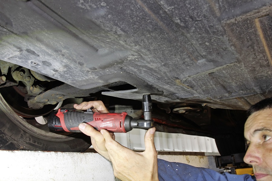 A Milwaukee impact ratchet in use.