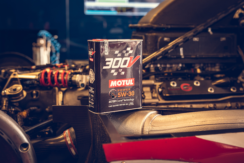 Can of engine oil placed on engine bay