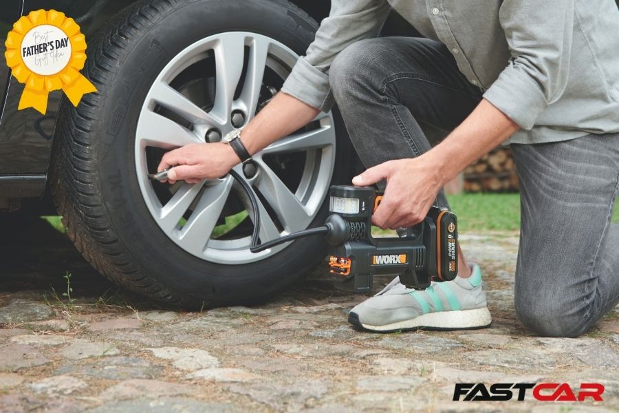 man using a tyre inflator